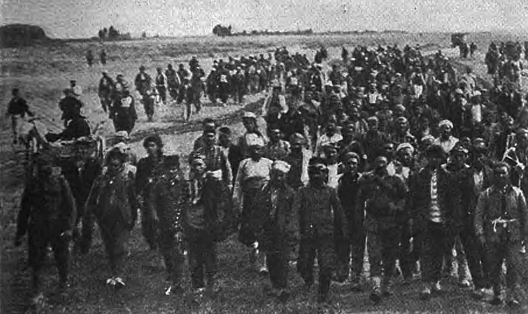 Greek prisoners being marched to an unknown destination.